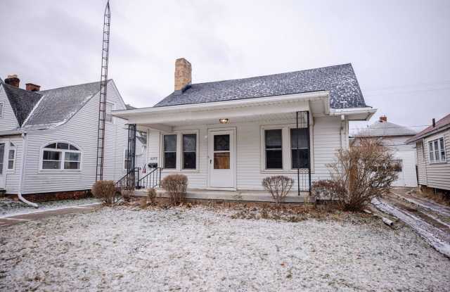 Beautiful two bedroom home with bonus room, fenced in back yard, garage, and full basement!