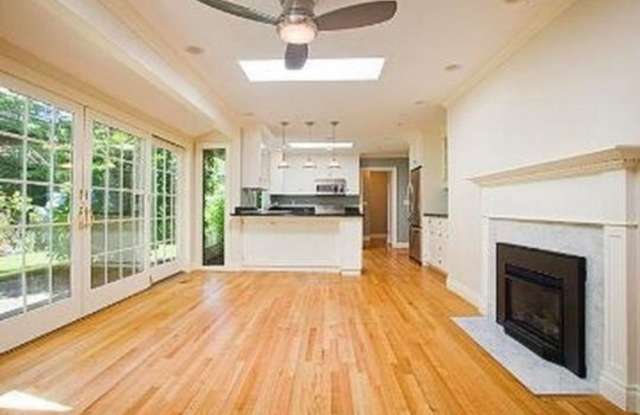 Photo of Spacious  light filled home with a garage, backyard, storage  hardwood floors throughout