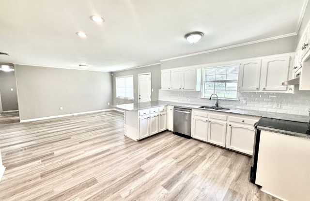 Bright & Spacious 3 Bedroom Brick Home with Double Carport & Large Backyard