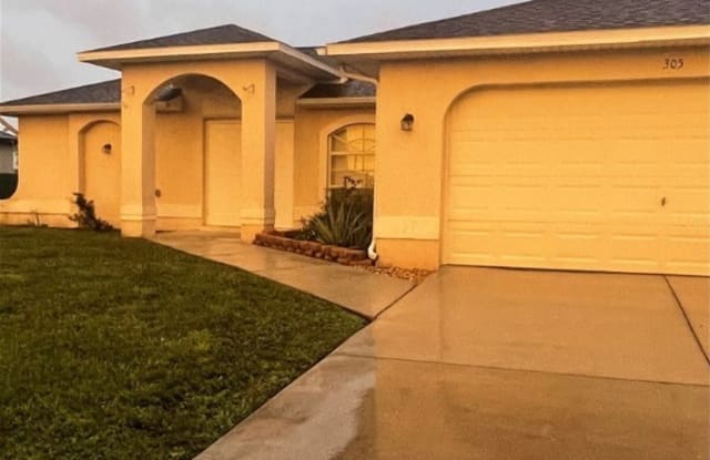 305 NW 22nd Place - 305 Northwest 22nd Place, Cape Coral, FL 33993