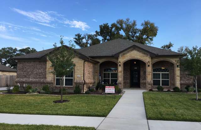 Photo of Beautiful 3 bedroom, 2.5 bath, 3 car garage home with garage door openers, fireplace, privacy fenced yard and covered patio.