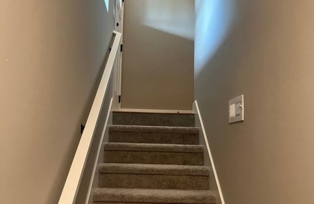 New Construction, 2 bed, 3 bath Row Home, with 2 car garage, fireplace, and rooftop deck!