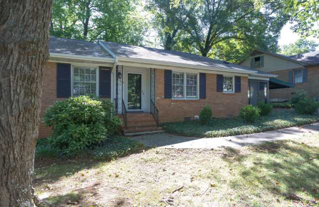 Gorgeous 3 bed 2 bath home with finished basement/carport in NW Greensboro! Lawn care included.