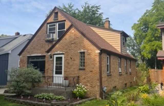 AVAILABLE SEPTEMBER 1: Updated 4-bedroom single family home on a quiet block- with 2 kitchens, 2 full bathrooms, basement space and MORE!