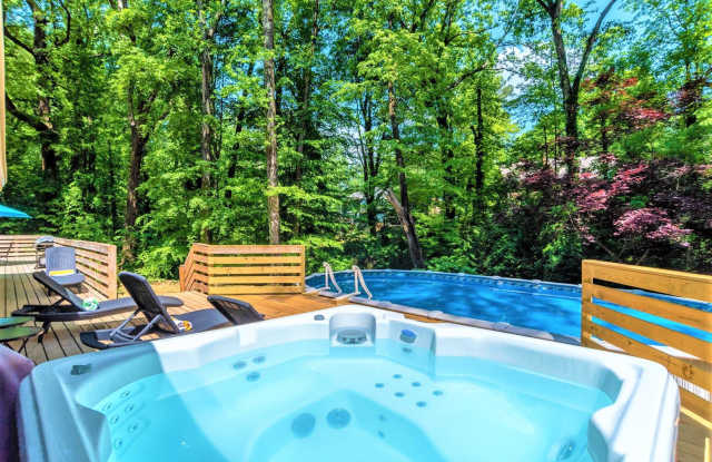 Photo of FURNISHED: Modern 6 Bdrm (7 beds) Home w/*HotTub*BBQ*Foosball*SUMMER:Pool -Close To Airport