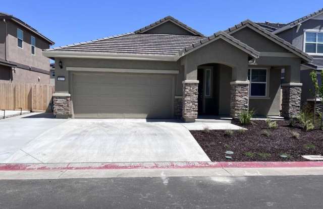 BEAUTIFUL NEW HOME IN GATED COMMUNITY!! - 8257 Courage Drive, Vineyard, CA 95829