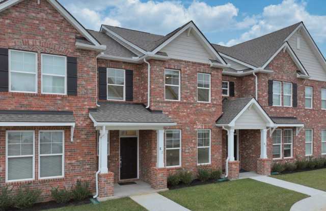 Photo of **BE THE FIRST PERSON TO LIVE IN THIS BRAND NEW BRICK TOWNHOME IN THE VILLAS AT REGAL SQUARE FEATURING A 2-CAR GARAGE WITH EPOXY FLOOR AND PRIVATE COURTYARD**