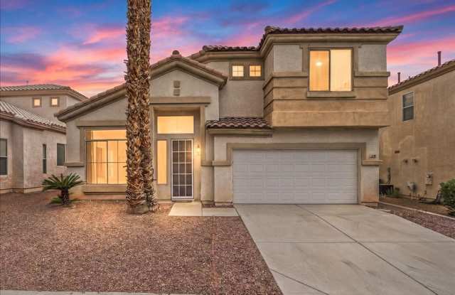 Contemporary Guard-Gated Retreat Near Rhodes Ranch Golf Club with Elegant Open-Concept Living