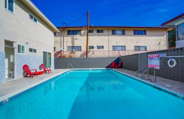 Retro Style Apartment Building with Pool and Gym - Secure, Modern and Lease-Ready!