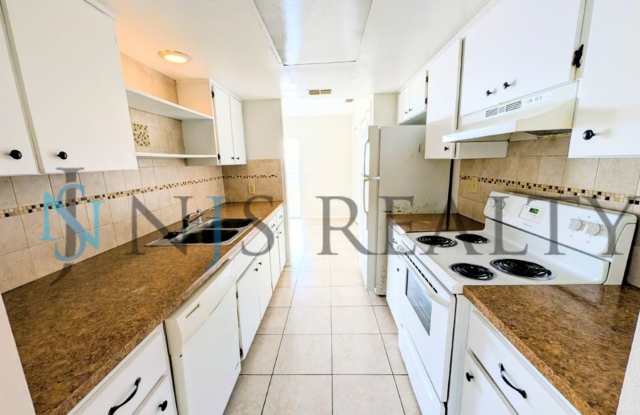 Beautifully updated 3/2/2 1500 Sq. Ft. with fenced yard, tile floors, HUGE living room and a corner lot!!