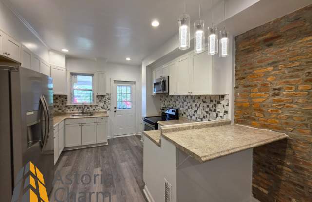 3 Bedroom End Unit with Finished Basement and Fenced Yard on E 28th Street