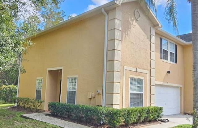 Gated Tampa Palms Townhome with 2 car garage