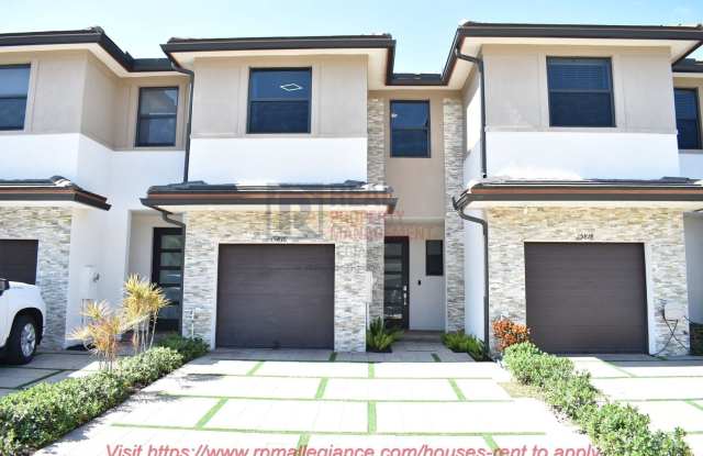Stunning 3-bed, 2.5-bath home in Miami Lakes w/impact windows, garage, electric car charger, gym, pool,  easy highway access. Modern secure living!
