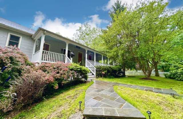 Beautifully renovated 4BR/3BA rambler with wraparound porch and garage