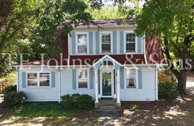 Charming 4-Bedroom Home with Hardwood Floors, Detached Garage & Spacious Patio