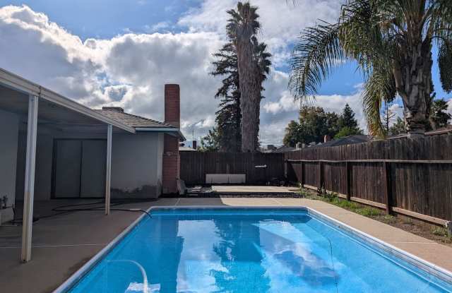 Nice home home offering nice amenities. Swimming pool + close to shopping and schools.