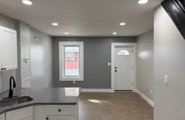 Newly Renovated 2- Story Townhome with Front Porch and Back Yard