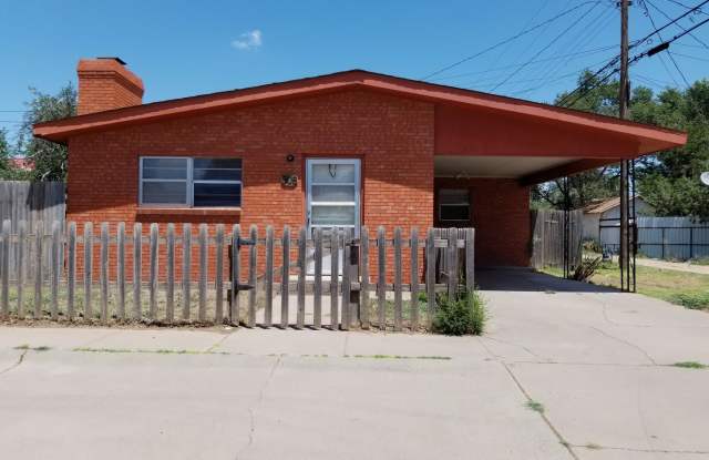 LARGE 1 BEDROOM WITH CARPORT BRICK HOME