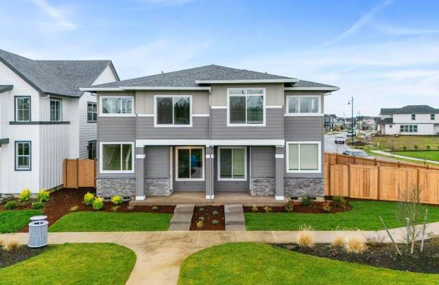 Photo of Modern 2025 Construction End Unit Featuring Open-Concept Living, Contemporary Kitchen  Two-Car Garage