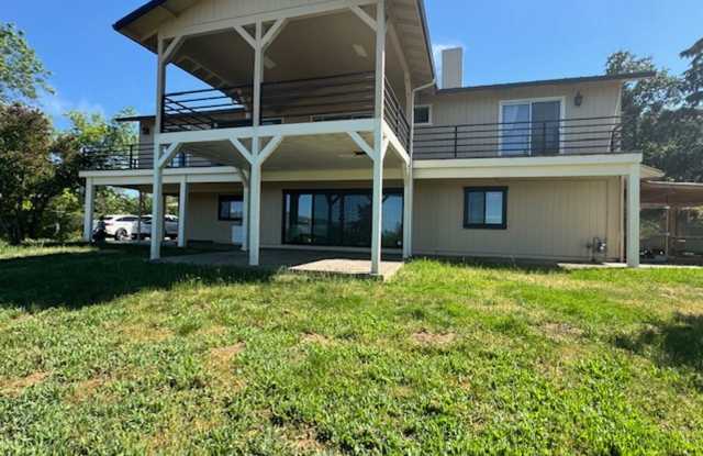 PRIVATE ONE OF KIND THAT SITS ATOP A HILLSIDE W/ VIEWS