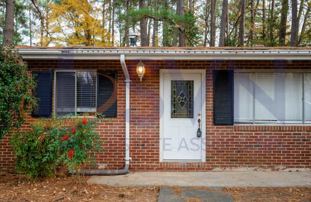 Charming Brick Ranch on a Spacious, Wooded Lot!