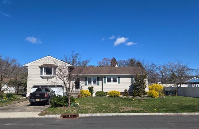 Spacious 3-bedroom, 1.5 bath single family home w/ 2-car garage  basement - 147 Brewster Avenue, Piscataway, NJ 08854