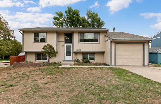 Updated 4-Bedroom Loveland Home with New Carpet, Fresh Paint & Wood-Burning Fireplace