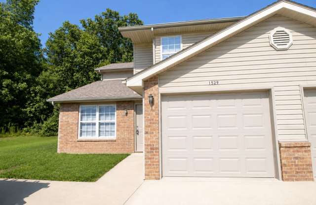 Four Bedroom, Three Bathroom Duplex with Attached Garage