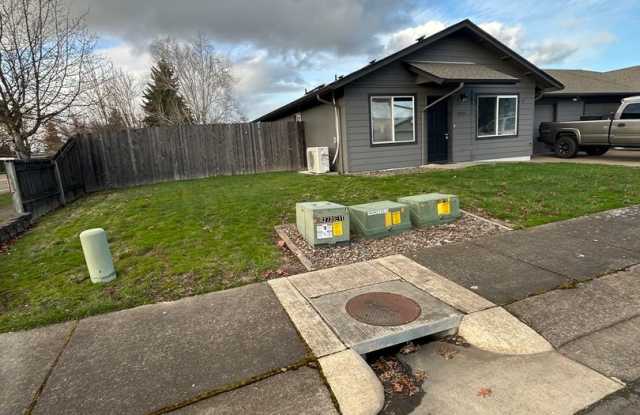Photo of Beautifully Remodeled 2 Bedroom 1 Bath Duplex w/ Large Yard!! Pets are welcome! Electric car charging station in garage!