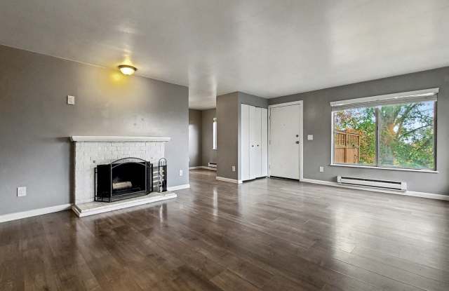 AVAILABLE NOW! Charming West Seattle Home featuring a garage, spacious deck, and wood-burning fireplace