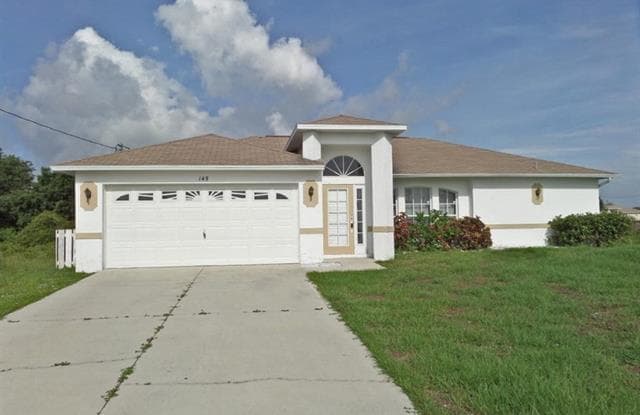 145 Grant BLVD - 145 Grant Boulevard, Lehigh Acres, FL 33974