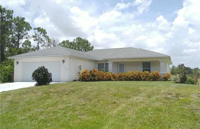 1143 Cove ST E - 1143 Cove Street, Lehigh Acres, FL 33974