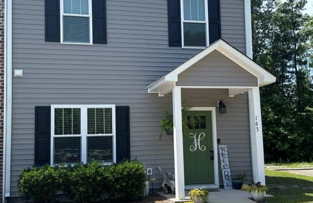 This spacious 3-bedroom, 2-bathroom townhouse offers modern living