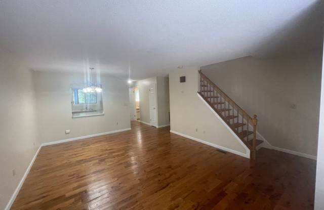 Photo of 2 Bed 1.5 Bath Condo with Quick Access To Highways, Huge Garage, Fenced Yard and Back Deck