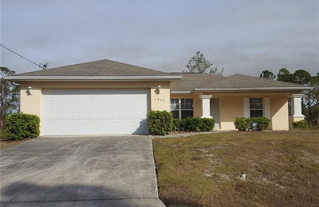 1057 Lilac ST E - 1057 Lilac Avenue, Lehigh Acres, FL 33974