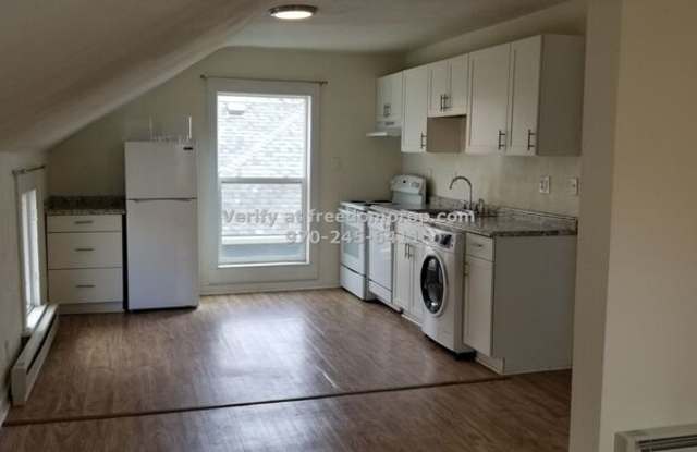 311 1/2 W First St