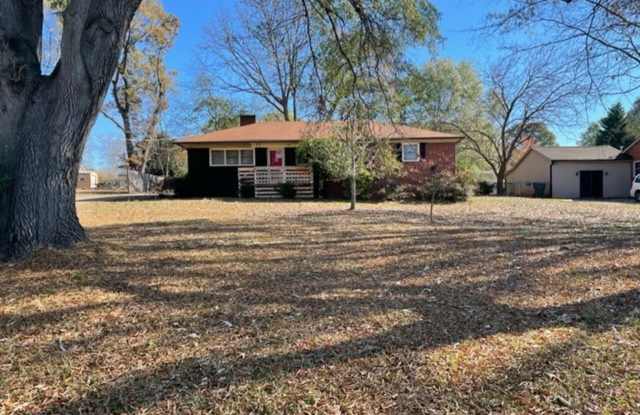 Photo of Adorable 3-bed 2-bath brick ranch, sitting on nearly a half acre lot, is located in Gastonia