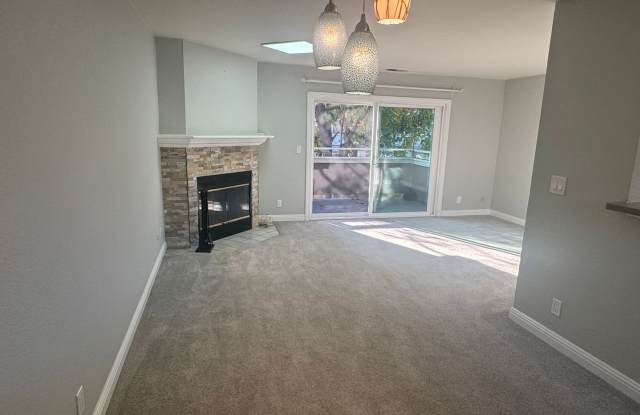 Charming top-level 2-bedroom, 1-bath condo in a highly desirable gated community.