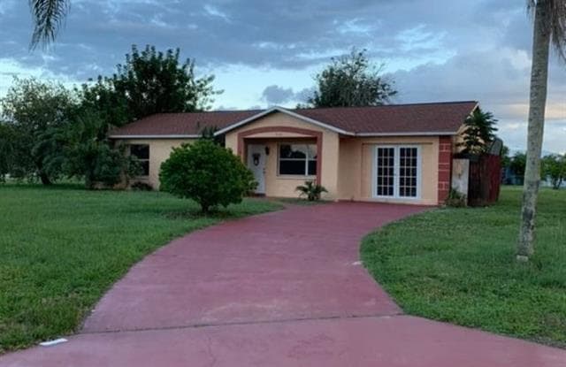 316 Poinsettia AVE - 316 Poinsettia Avenue, Lehigh Acres, FL 33936