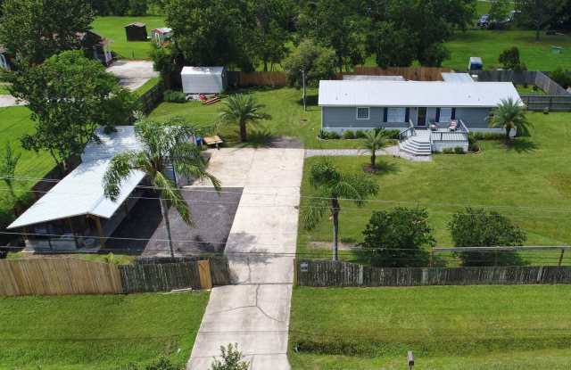 Photo of Private (Gated) Country Retreat - RV Hookups, 2 Decks, Back Patio, Outdoor Gaming/Utility Area, Shaded Florida Room, and more!