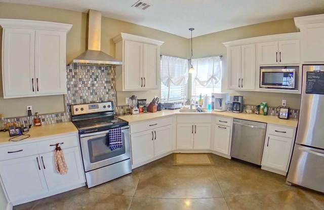 Cute West Side Home W/ Two Car Garage + Fenced In Yard + Rooftop Balcony! Available June 4th!