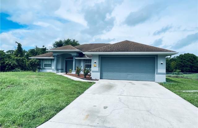 411 Greenwood Avenue - 411 Greenwood Avenue, Lehigh Acres, FL 33972