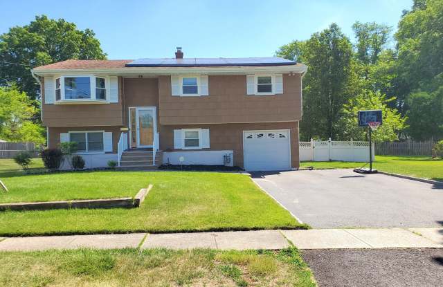 Photo of Single family, bi-level home with 4-bedrooms (one bedroom on ground level), 2.5 bathrooms, attached garage, "bonus room"  utility room located on a dead-end road!