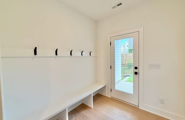 **OFFERING RENT PROMOTION FOR THE FIRST 6 MONTHS** Luxurious New Construction 4BD, 4BA Downtown Raleigh Townhome with Rooftop Terrace