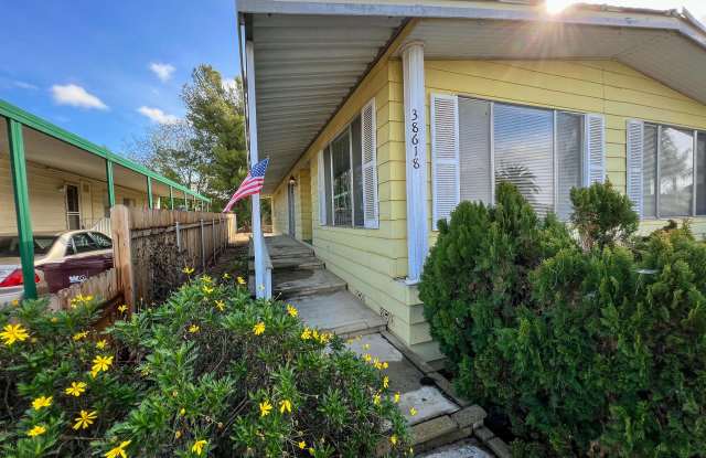 2 Bedroom home located in a 55+ community with AMAZING backyard views