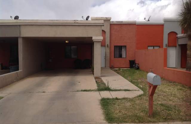 Modern town home with AC. 3/2. Covered, off-street parking, easy care yard.  Ample kitchen. Laminate and tile floors.