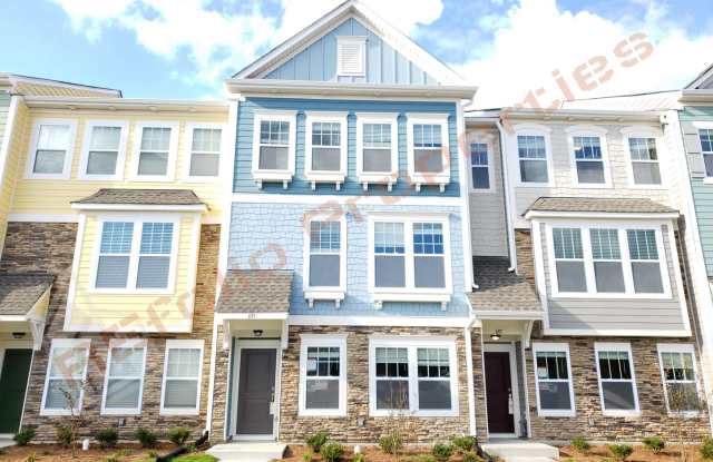Beautiful Luxury 3 Story 3 Bedroom Townhome with 1st Floor Guest Suite, Attached 2 Car Garage, Community Pool and Fitness in Villages of Apex! Available Aug 7th!