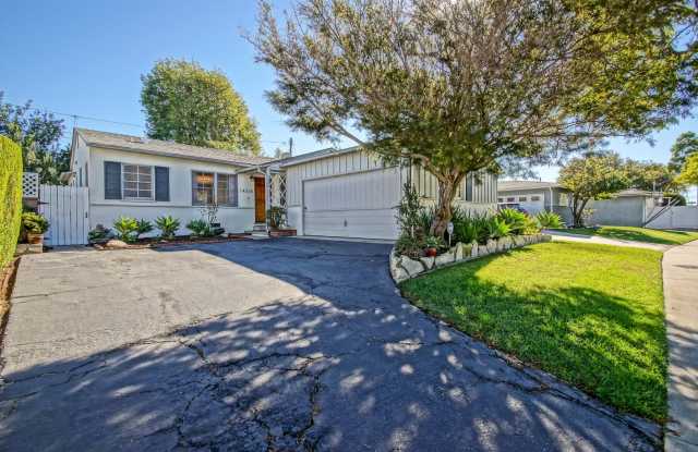 CHARMING, BRIGHT & AIRY HOLLYGLEN HOME W/ BEAUTIFULLY LANDSCAPED FRONT & REAR YARDS W/ PATIO BLOCKS TO SHOPPING, AWARD WINNING WISEBURN SCHOOLS, FREEWAY ACCESS & JUST MINS TO BEACH!