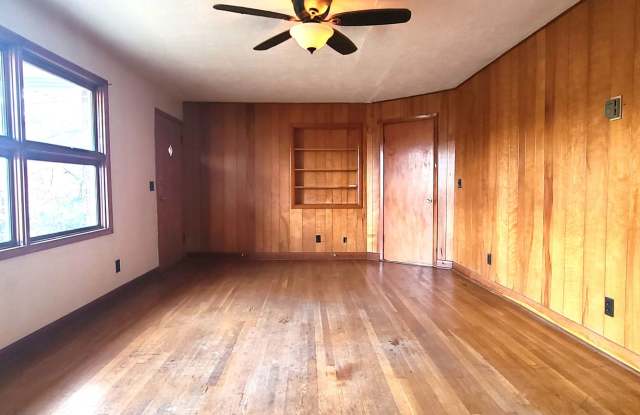 HALF OFF FIRST MONTH RENT! Single family brick home with full unfinished bsmt  detached garage