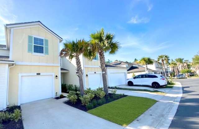 Photo of Modern 3 Bed 2.5 Bath Townhome. Garage. Lanai. Amenities. Pet Friendly. Lawn Care Included! Application Fee and Lease Fee Waived!